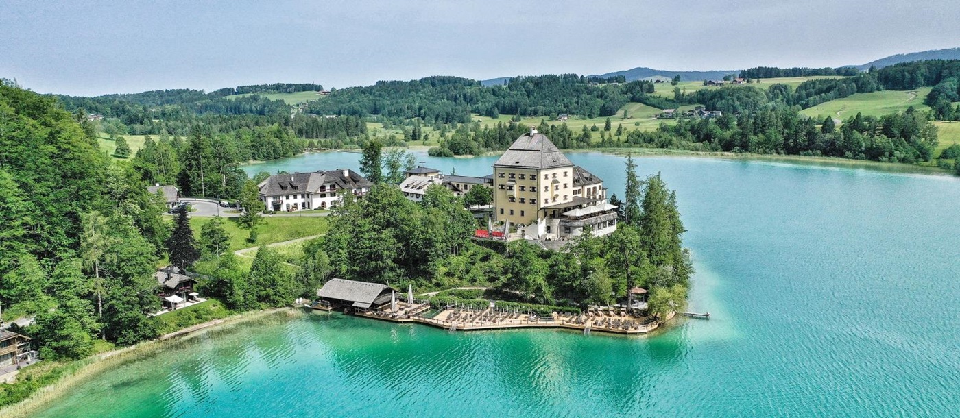 Aerial view of luxury hotel Schluss Fuschl in Austria and the lake