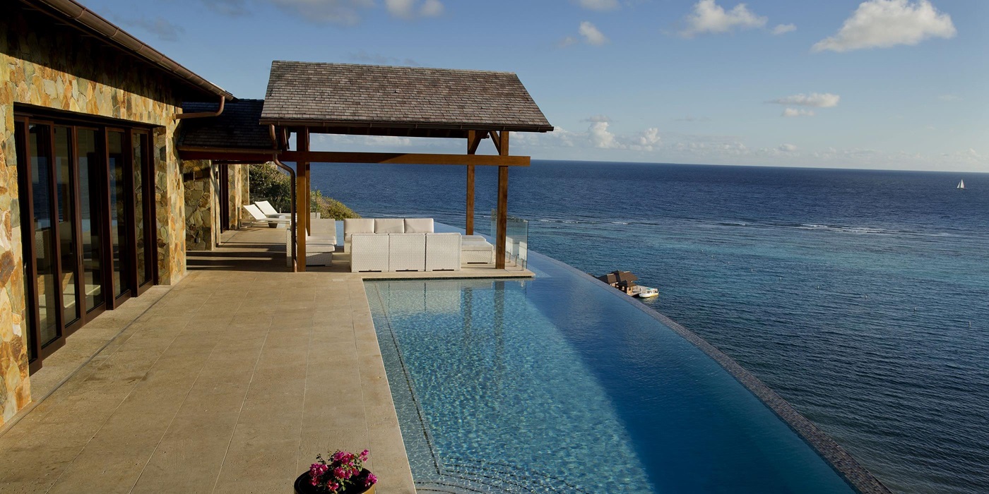 Swimming pool and ocean near Water's Edge Villa, British Virgin Islands