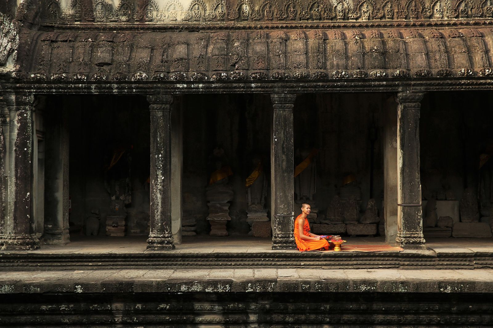 Monk outside temple near Amansara in the Siem Reap region of Cambodia