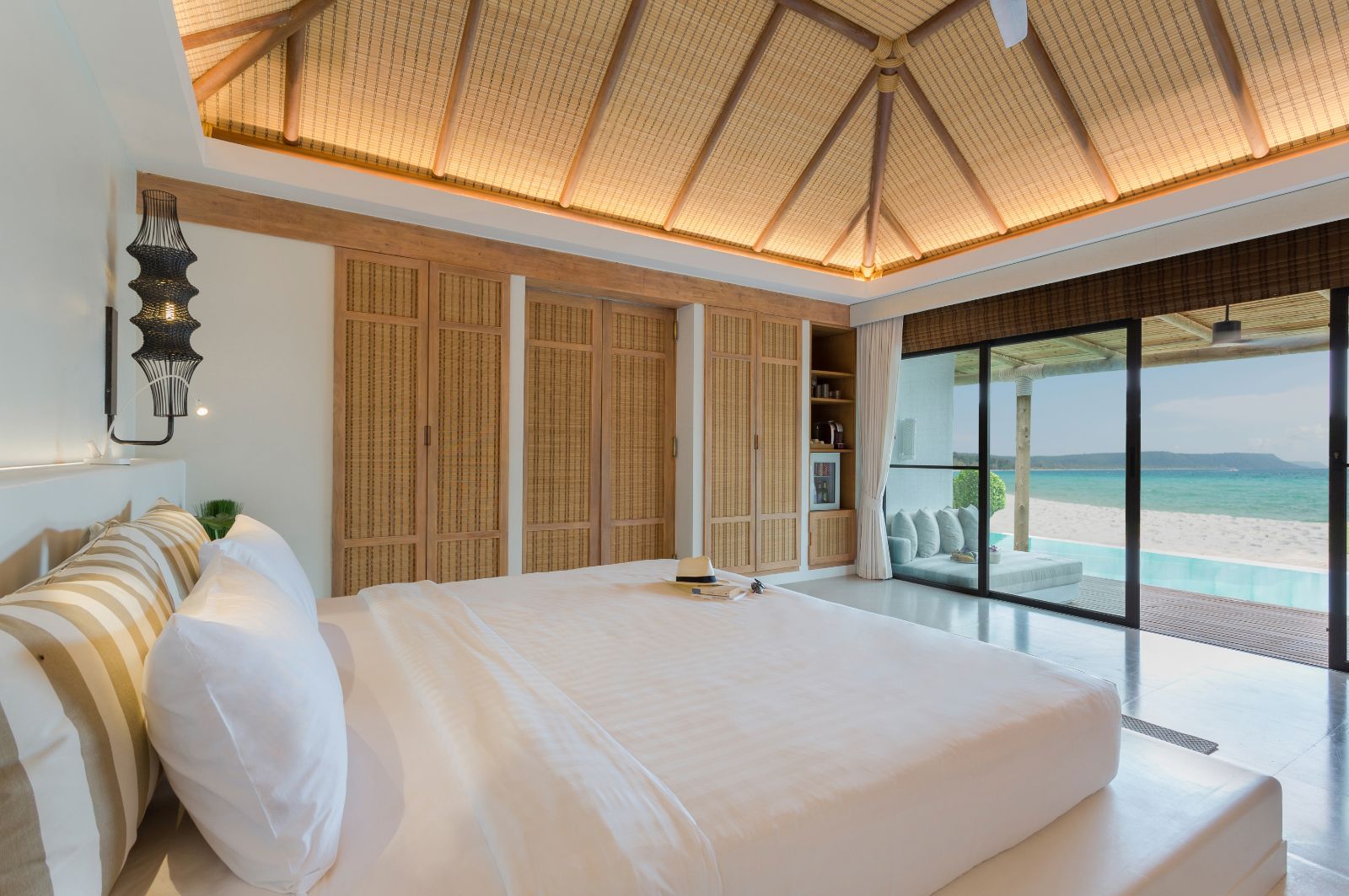 Beachfront pool villa bedroom at the Royal Sands Resort in Koh Rong, Cambodia