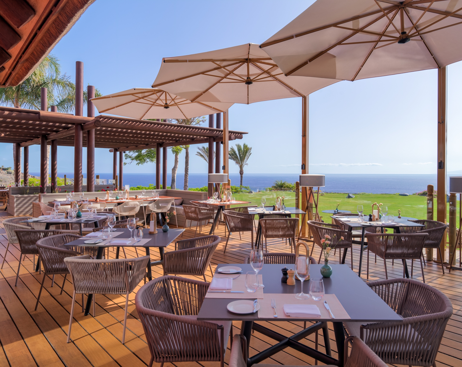 Terrace dining under parasols and with views over the Mediterranean Sea at El Mirador Restaurant at luxury resort Ritz Carlton Abama on Tenerife