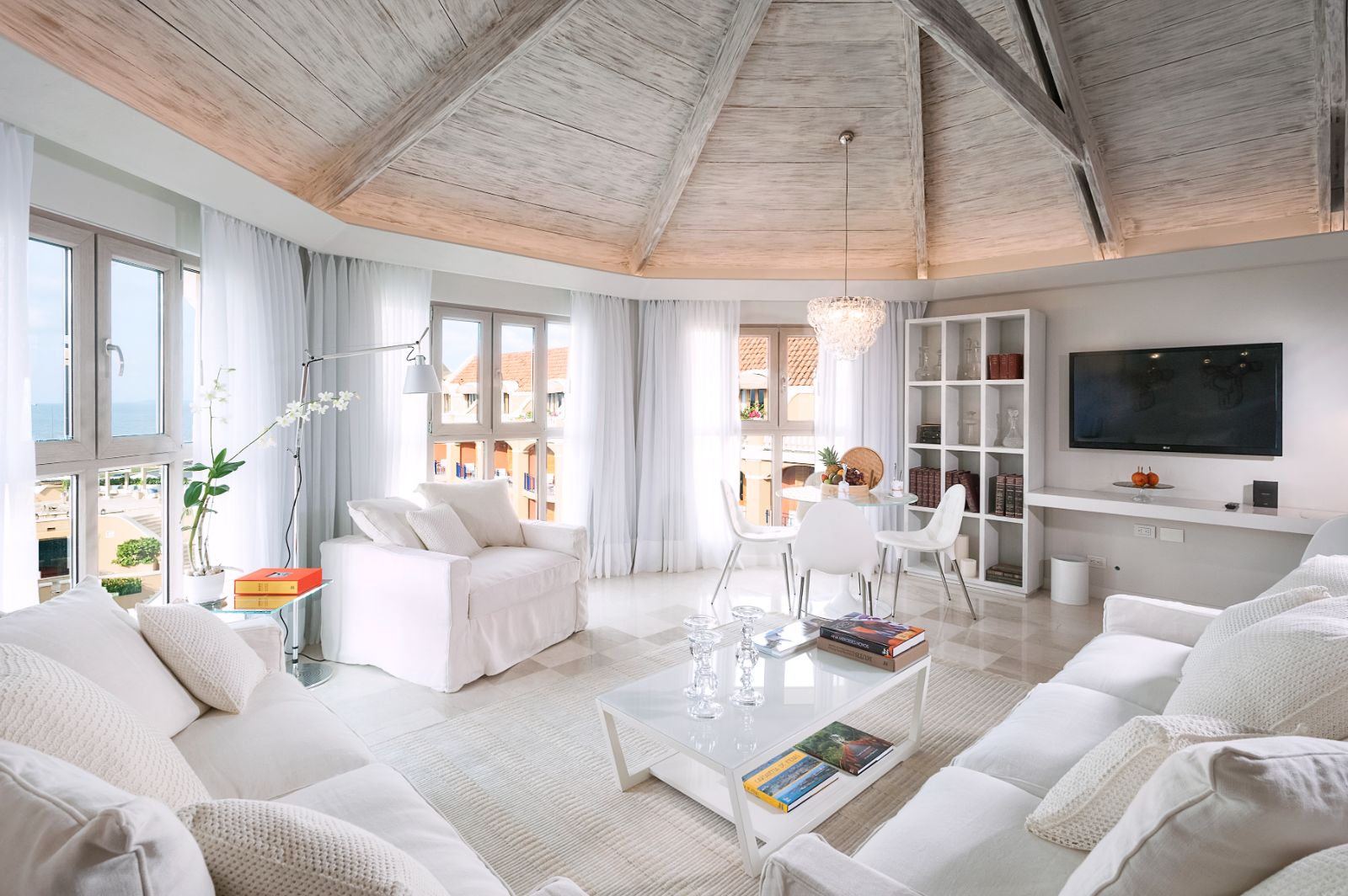 White guest suite living area at Sofitel Legend Santa Clara in Cartagena, Colombia