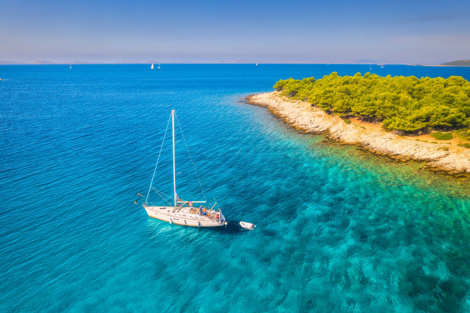 Aerial view of a gulet sailing in turquoise waters in Croatia