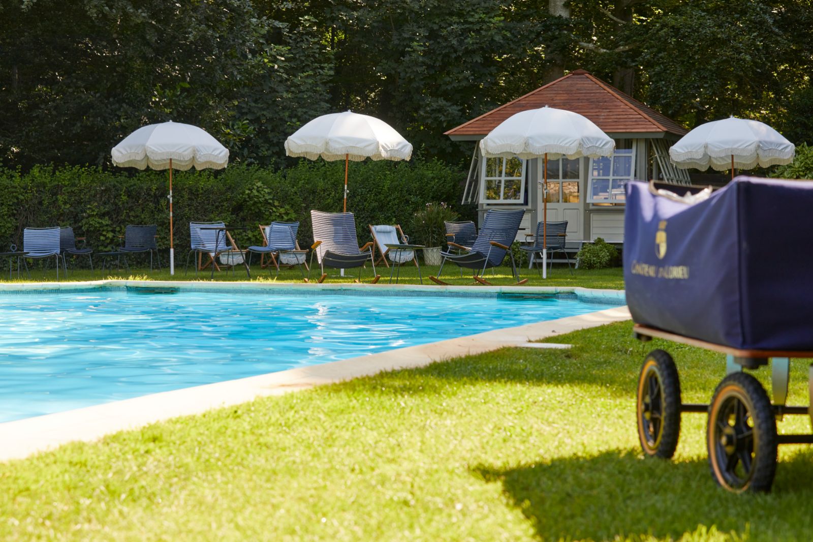 Poolside and sunbeds at Chateau d'Audrieu in the Normandy region of France