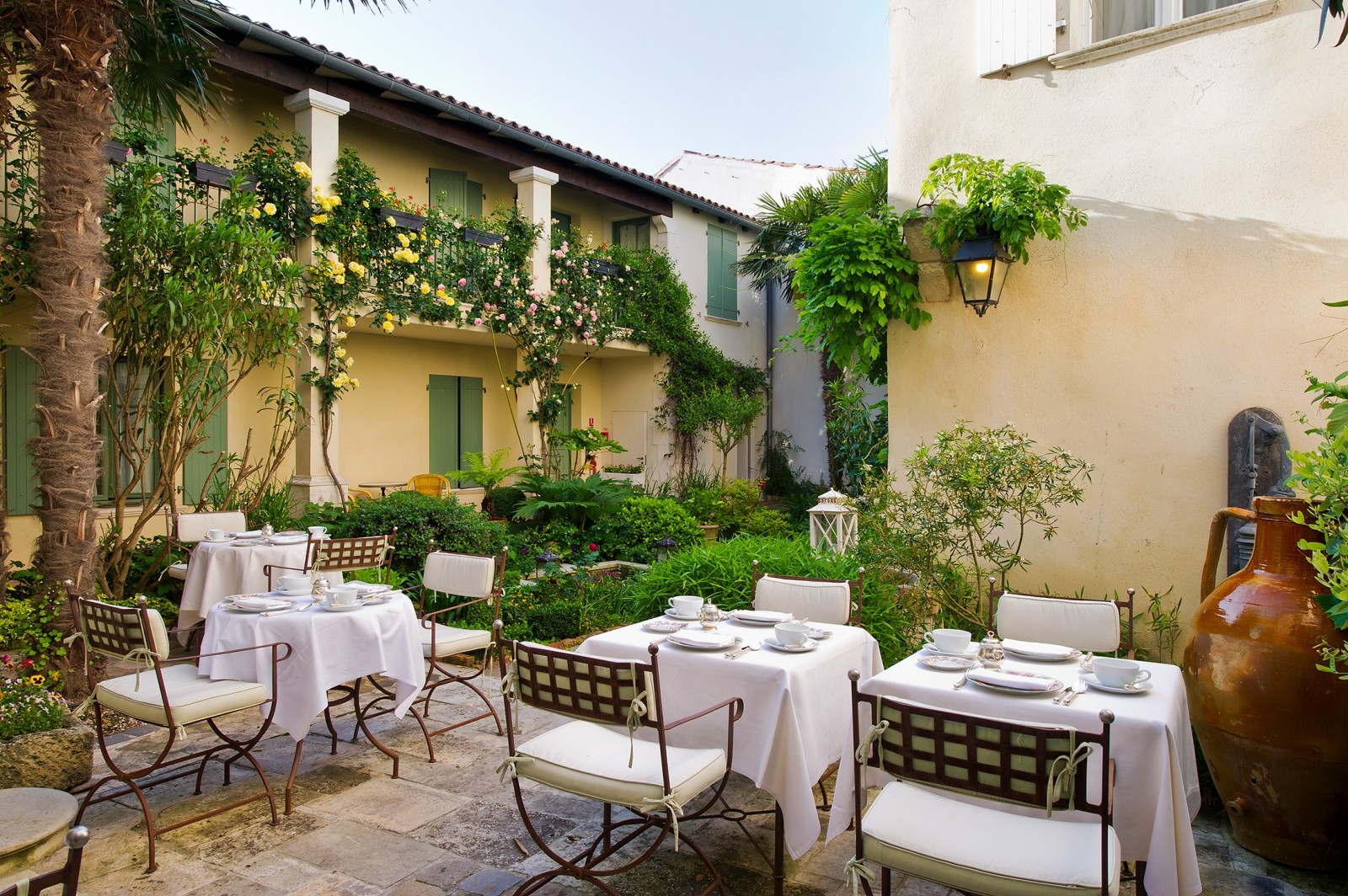 Tables set in a beautiful courtyard at Hotel de Toiras