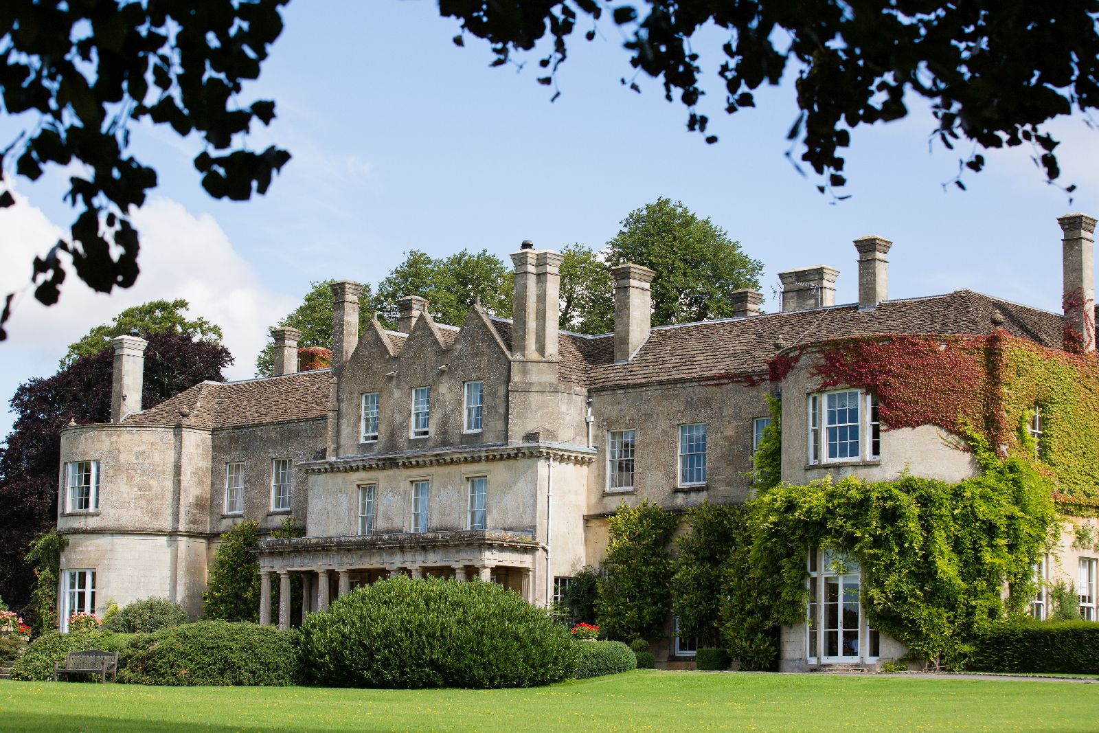 Exterior and grounds of Lucknam Park hotel in the Cotswolds England