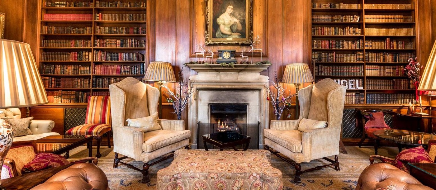 The library and fireplace at Lucknam Park hotel in the Cotswolds England
