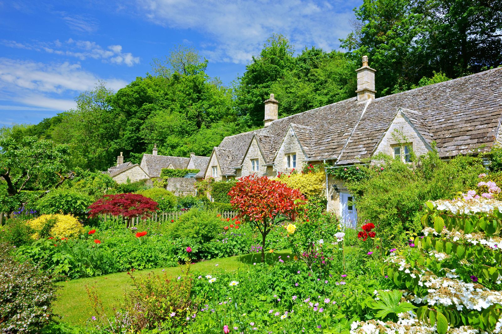 Cottages with colourful gardens in the Cotswolds in England