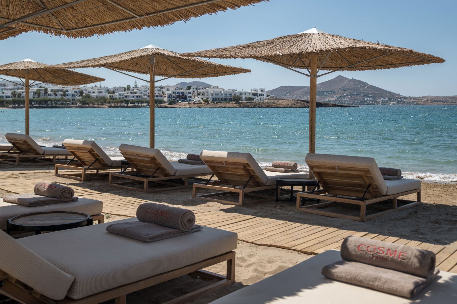 Sun loungers on the private beach at the Cosme Resort in Paros Greece