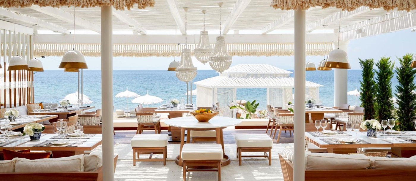 Dining with a seaview at Anithos Restaurant at luxury resort Danai Beach in Greece