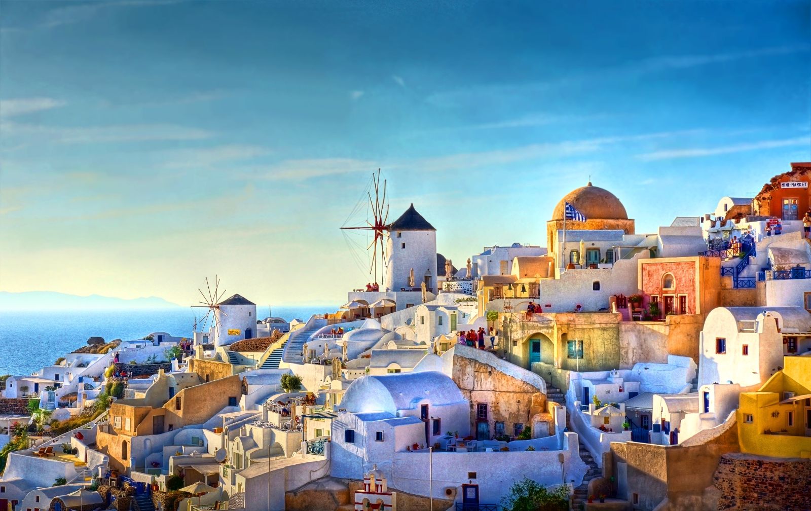 Windmills and colourful rooftops in Oia Santorini