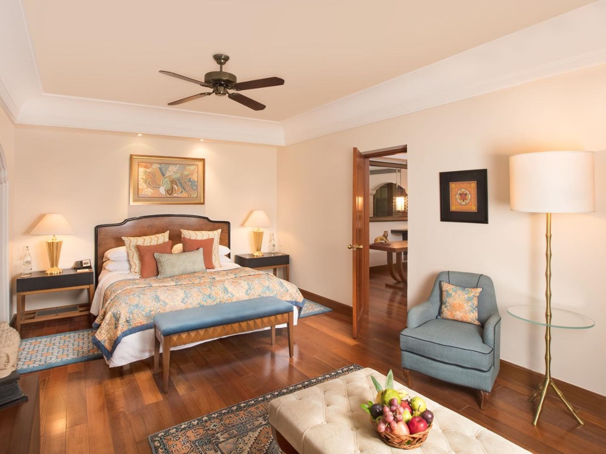 Spacious garden suite bedroom with living space in luxury hotel in India