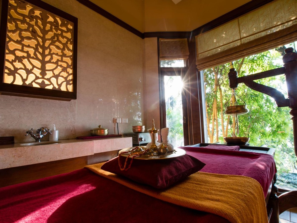 Calming spa treatment room with traditional Indian experiences in luxury hotel in India.