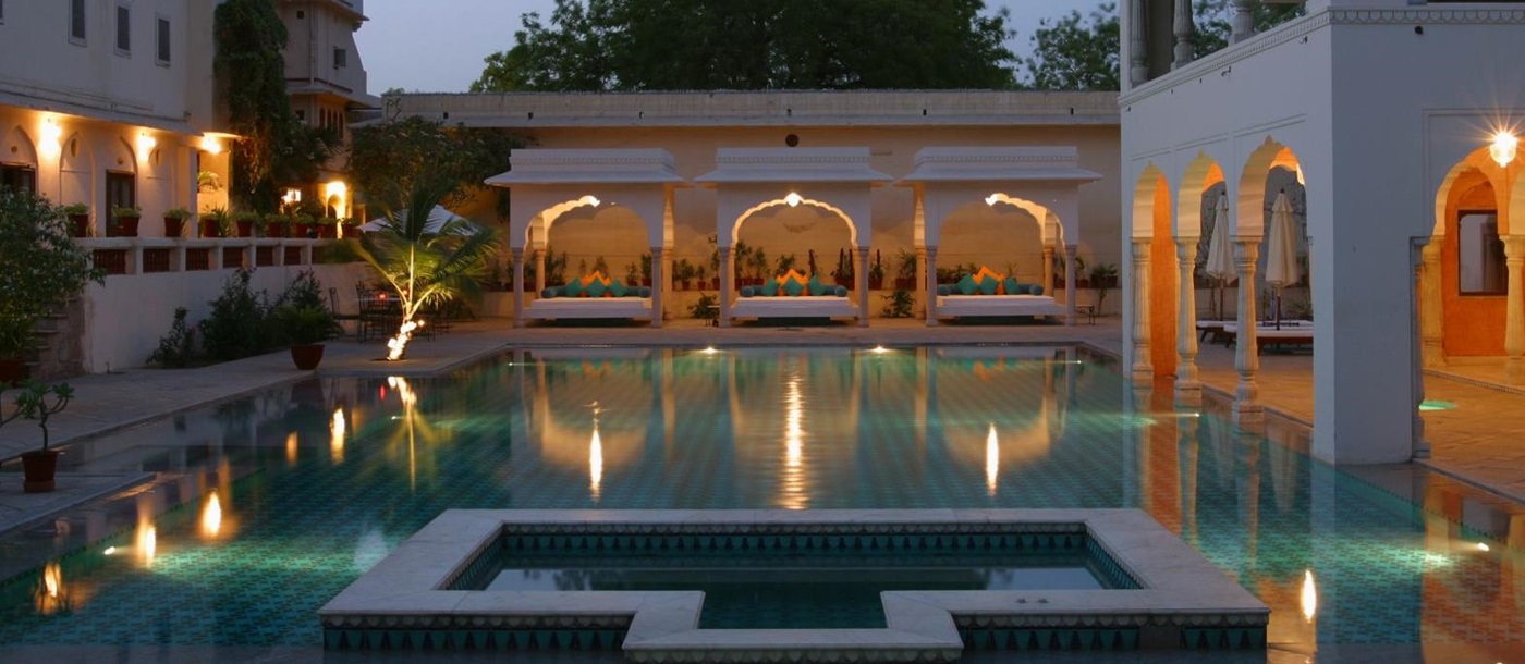 Swimming pool at dusk at the Samode Haveli hotel in Jaipur