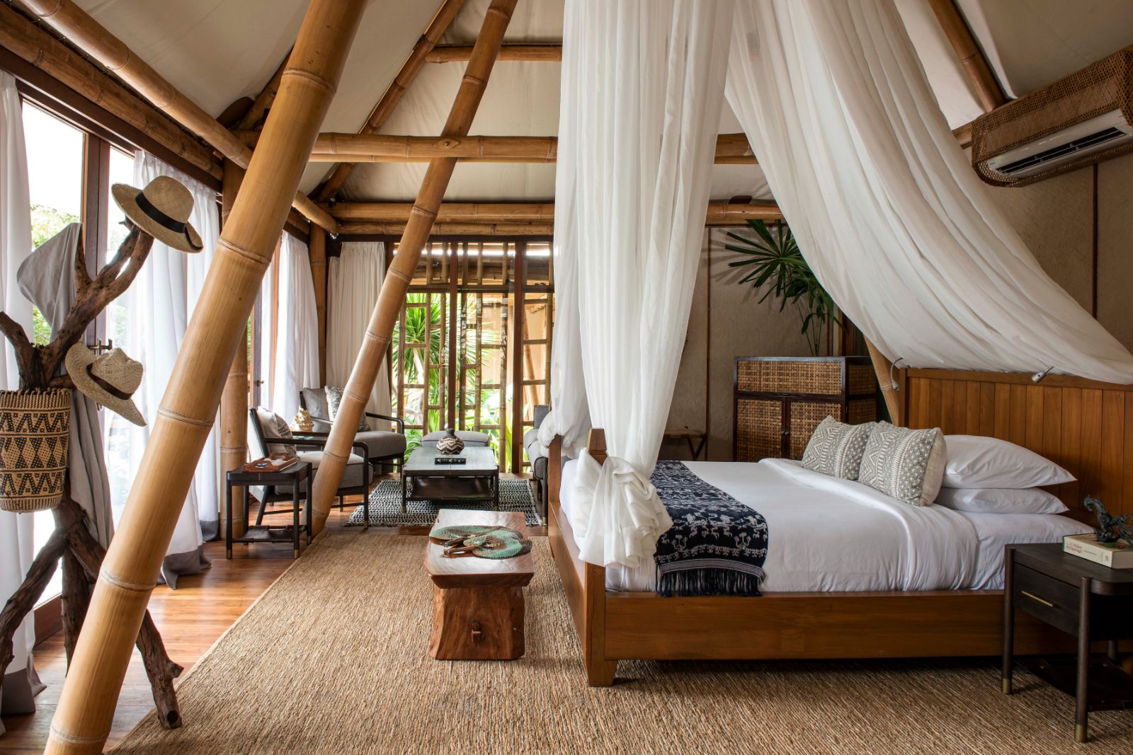 Bedroom in a deluxe pool villa at luxury resort Bawah  