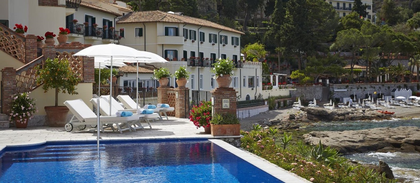 Outdoor swimming pool at Belmond Villa Sant'Andrea in Sicily