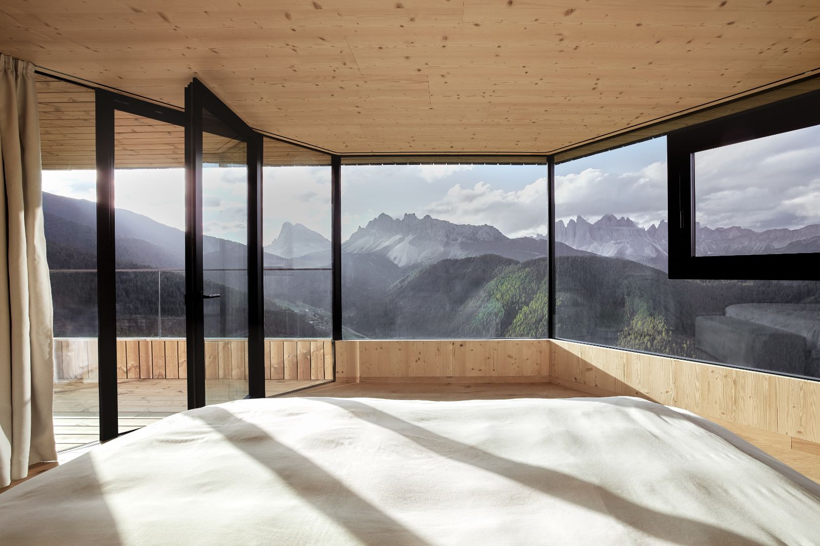 Penthouse suite bed at the Forestis hotel in the Dolomites