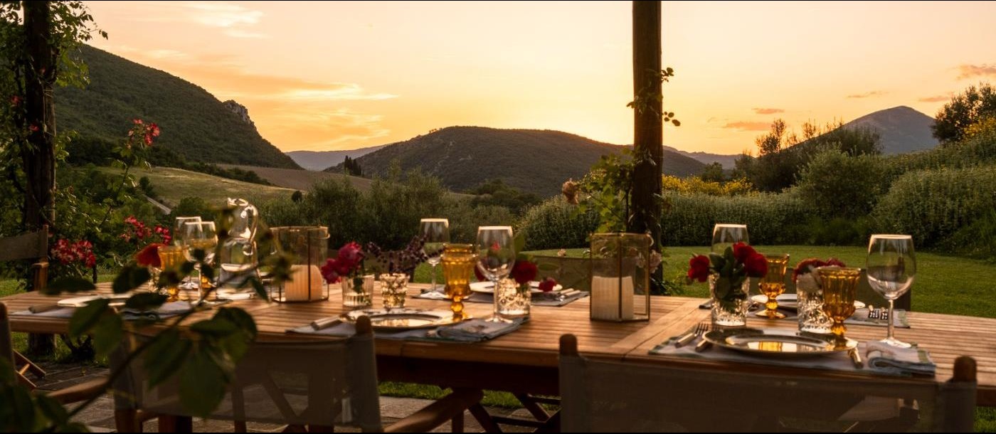 Outdoor dining space with spectacular views at Villa Il Canto.