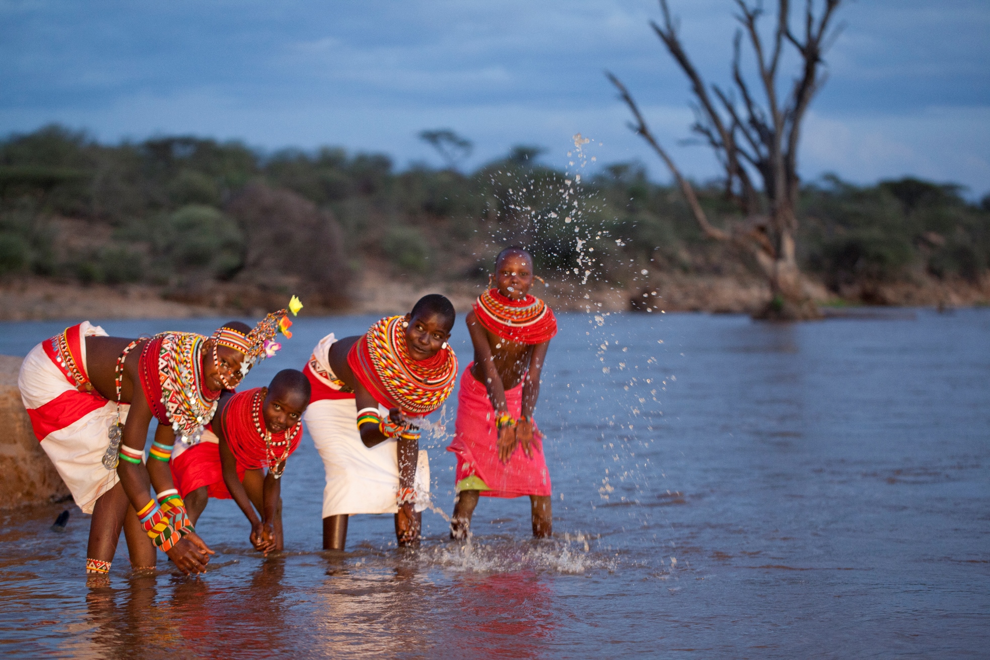 Maasai tribe playing in water near Saaab camp, kenya