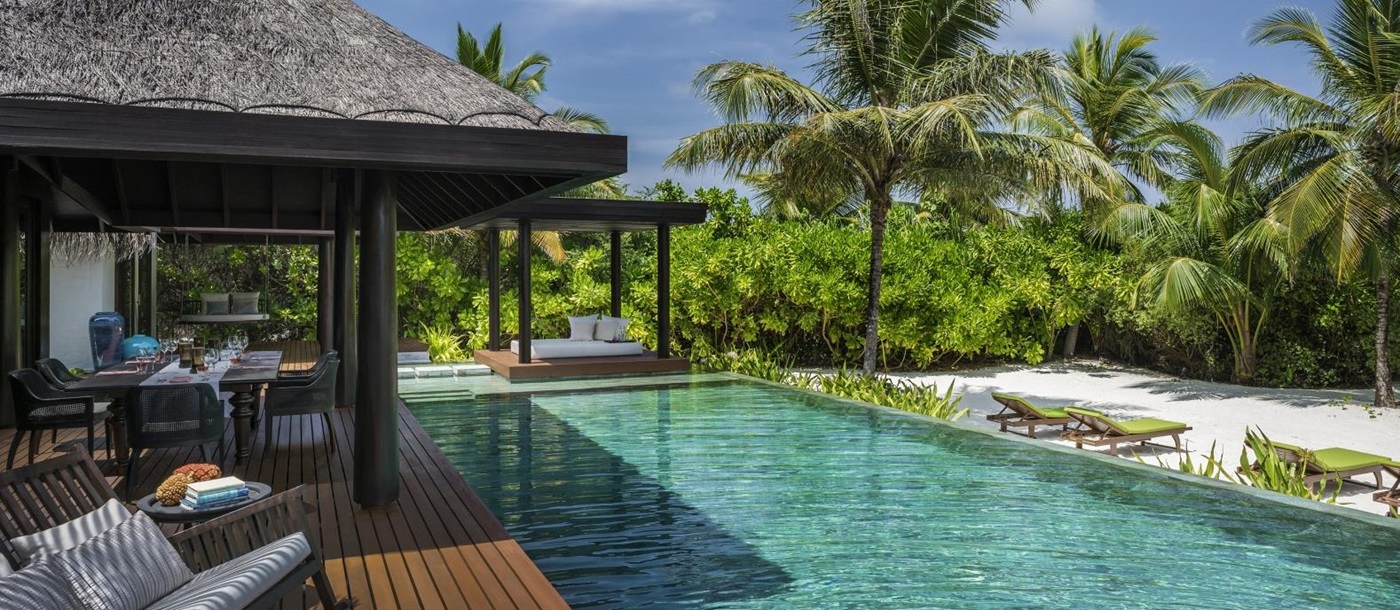 Private deck and pool of a three-bedroom Residence at luxury resort Anantara Kihavah in the Maldives