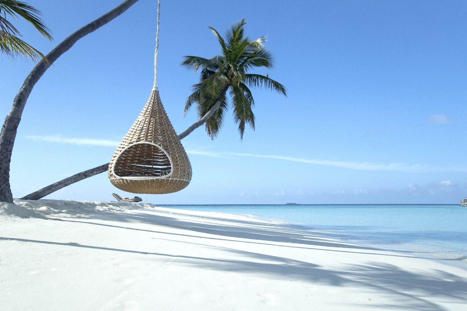 Swing seat and perfect beach scene at Constance Halaveli Maldives