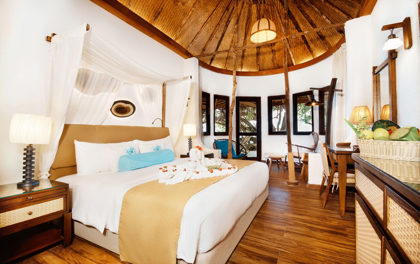 Double guest suite bedroom at Mukunudu Island resort in the Maldives
