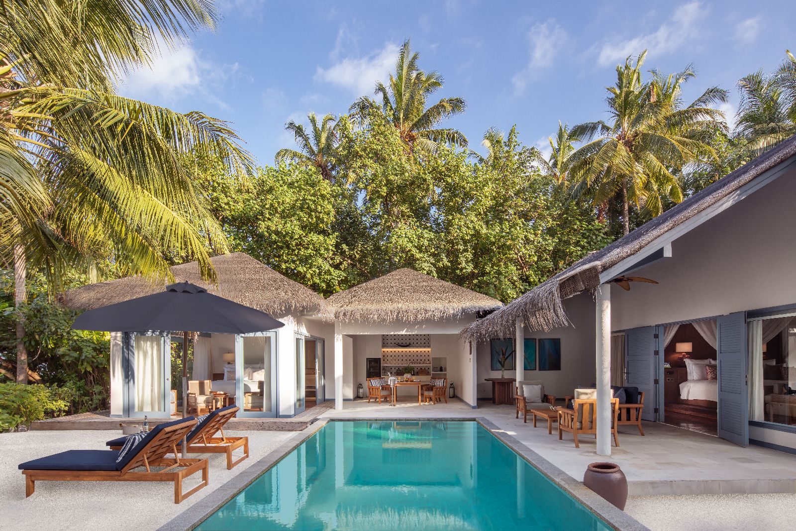 Garden and pool of a Beach Residence at Raffles Maldives Meradhoo