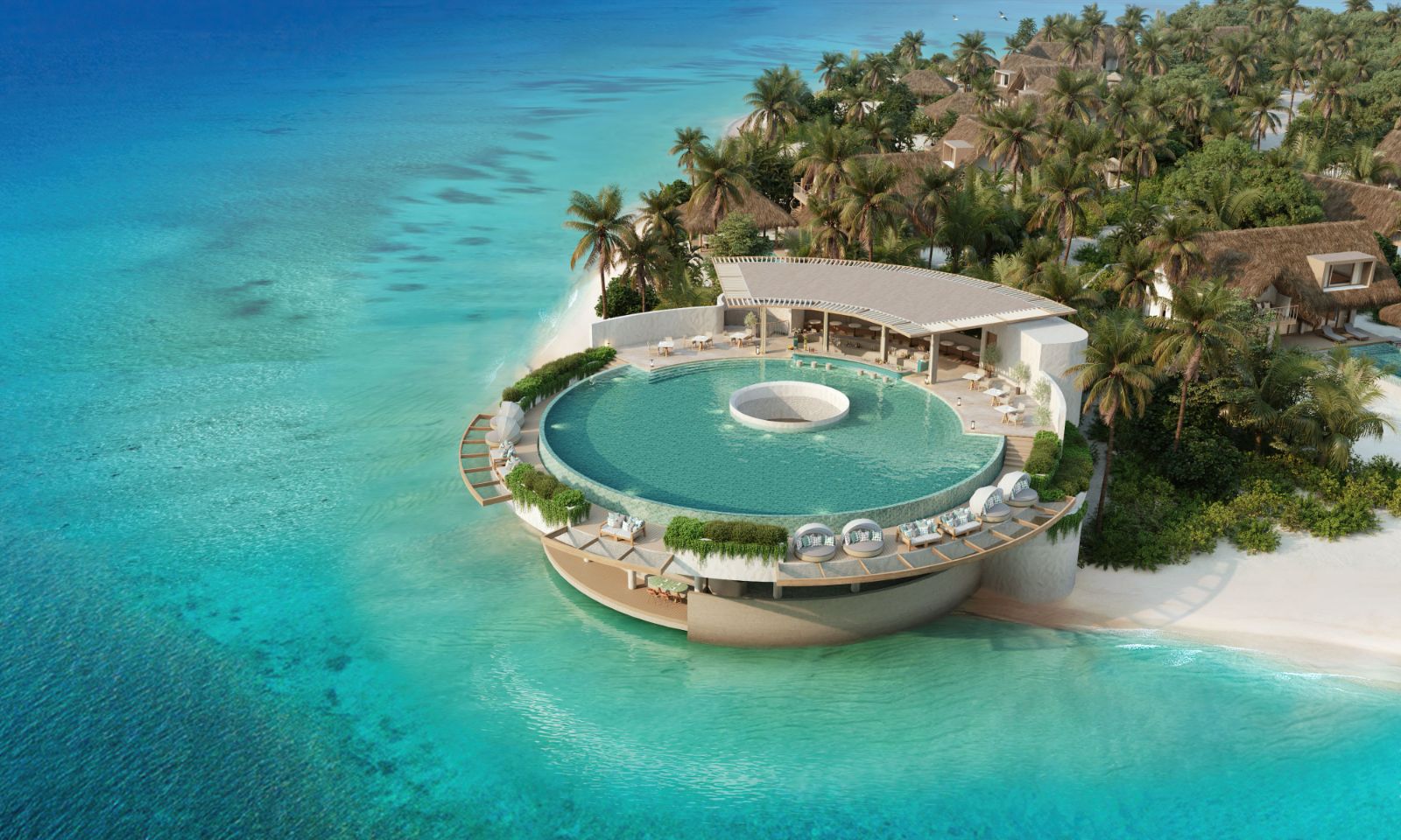 Aerial view of the circular infinity pool at Six Senses Kanuhura Maldives