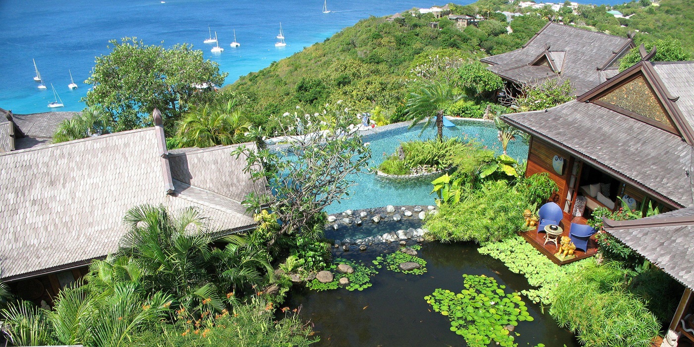 The gardens and house and pond of Ilanga, Mustique
