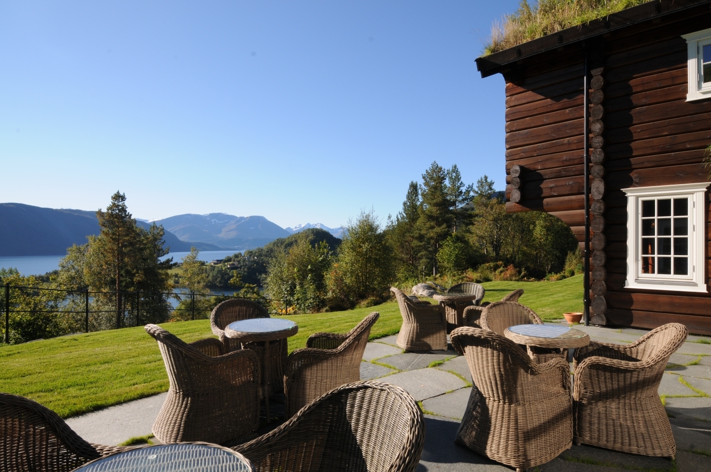 Open outdoor terrace with view of fjord at Storfjord Hotel in Norway