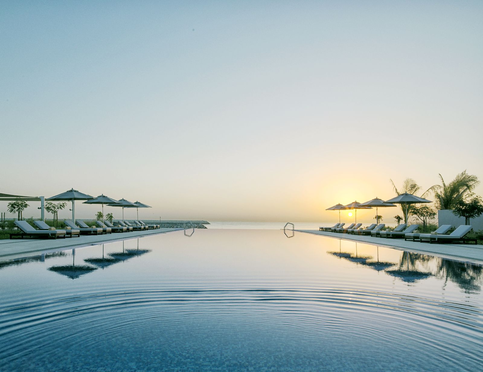 Infinity pool at sunrise at the Kempinski Hotel Muscat in Oman