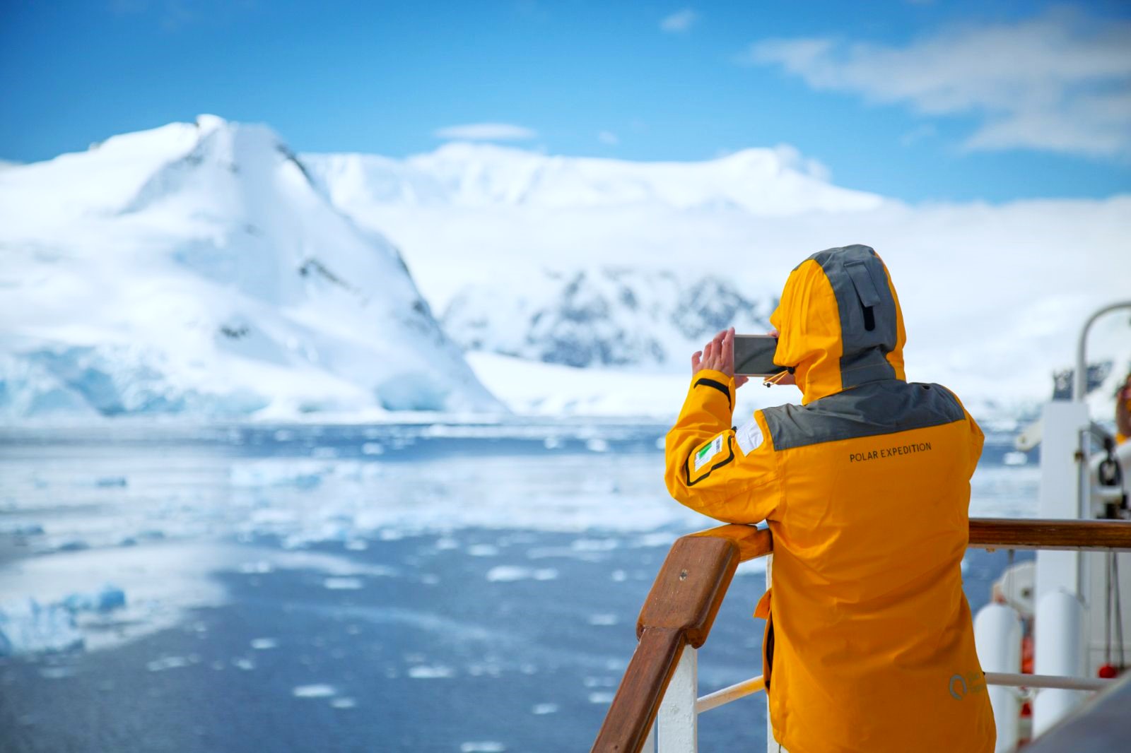 A guest onboard the Quark Ultramarine taking a photograph of the Antarctic scenery
