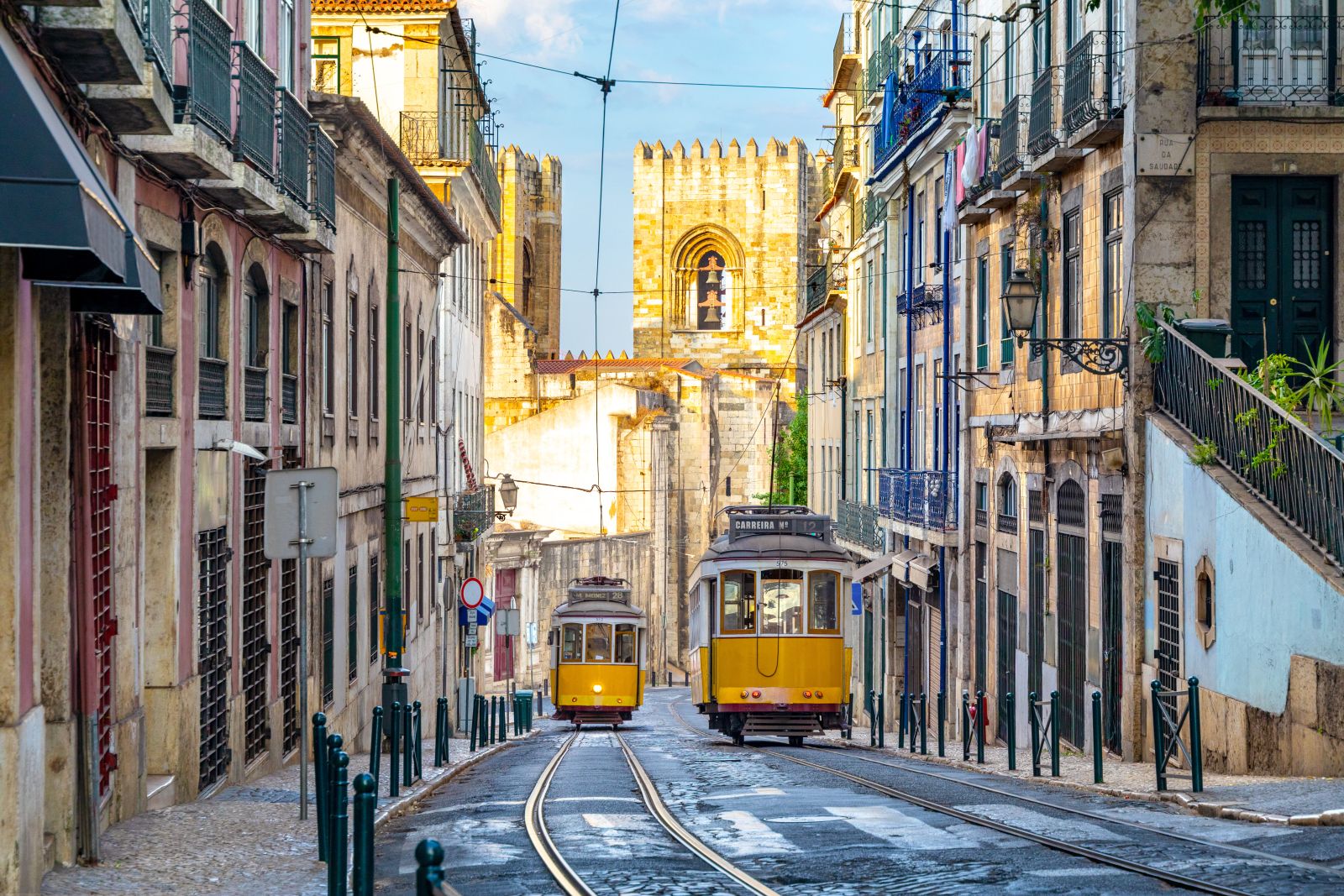 Yellow trams on the streets of Lisbon's historic nieghbourhoods