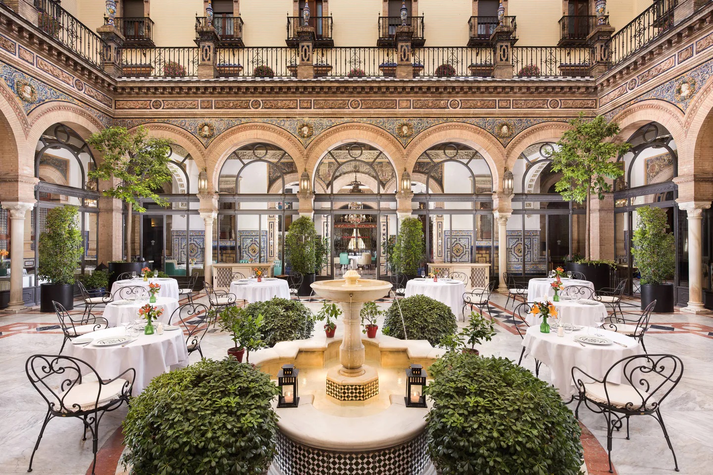 Bright central courtyard and fountain at Hotel Alfonso XIII Seville