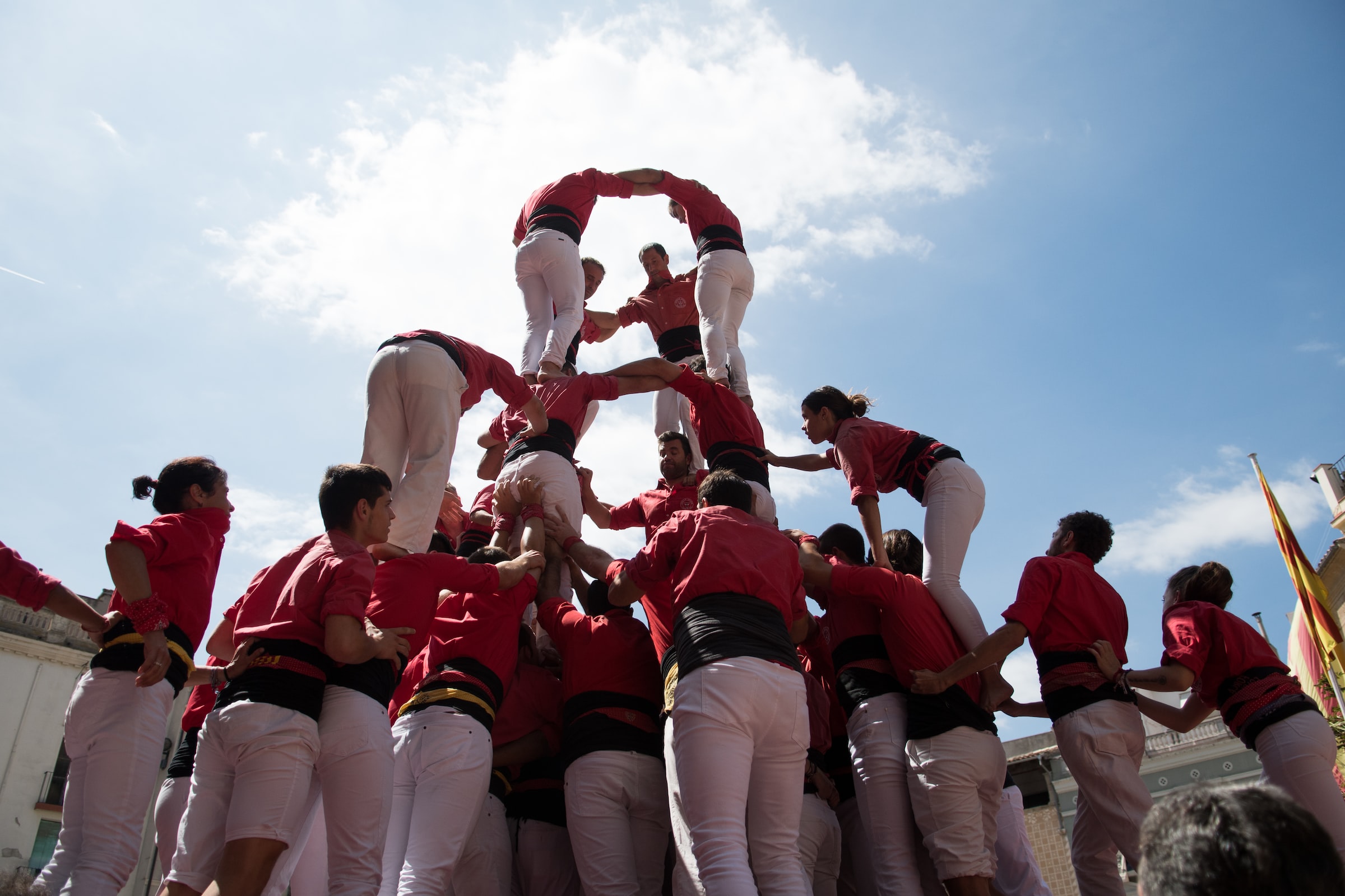 Crowd performs a Castell, known as a human tower, in Spain