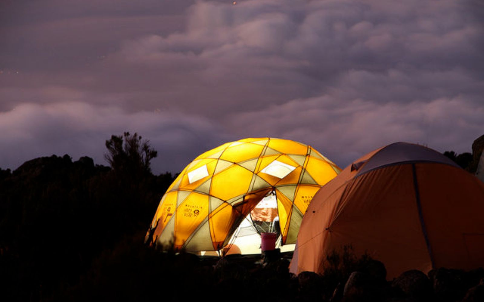 Comfortable tented camp at night on Mount Kilimanjaro climb in Tanzania