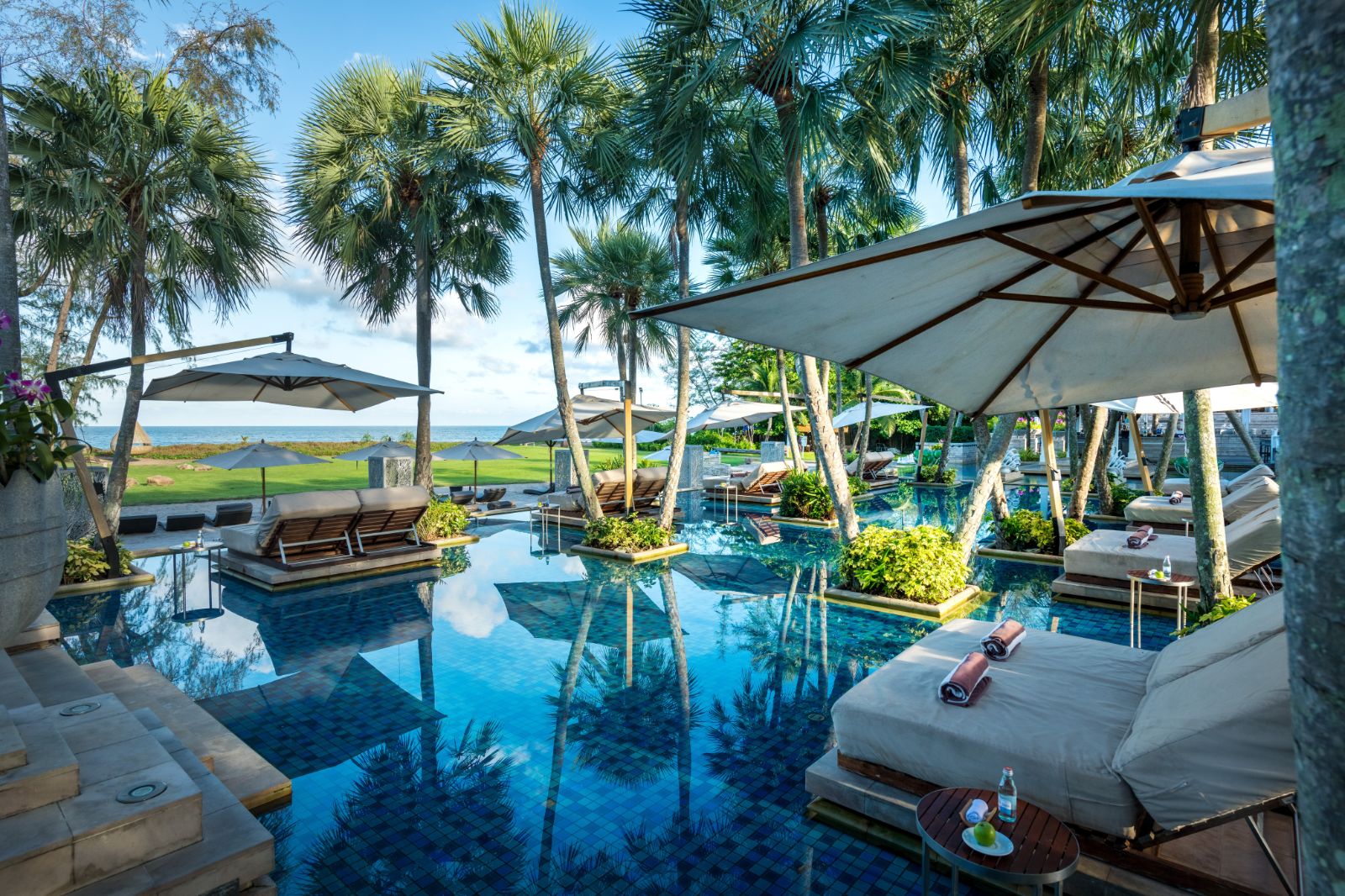 Pool and sunbeds at Anantara Mai Khao Phuket Villas in Thailand