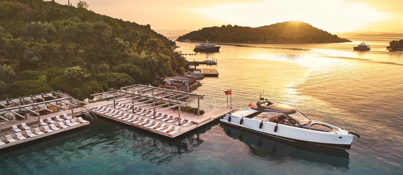 Macakizi's waterfront deck and private boat in Turkey