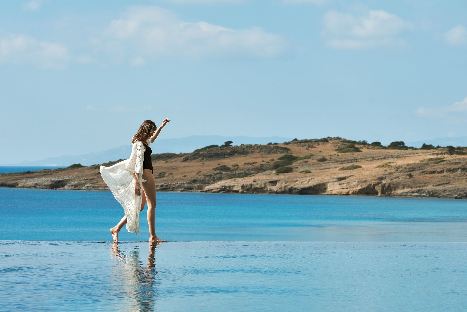 Guest enjoying the sea facing infinity pool the Mett Bodrum hotel in Turkey