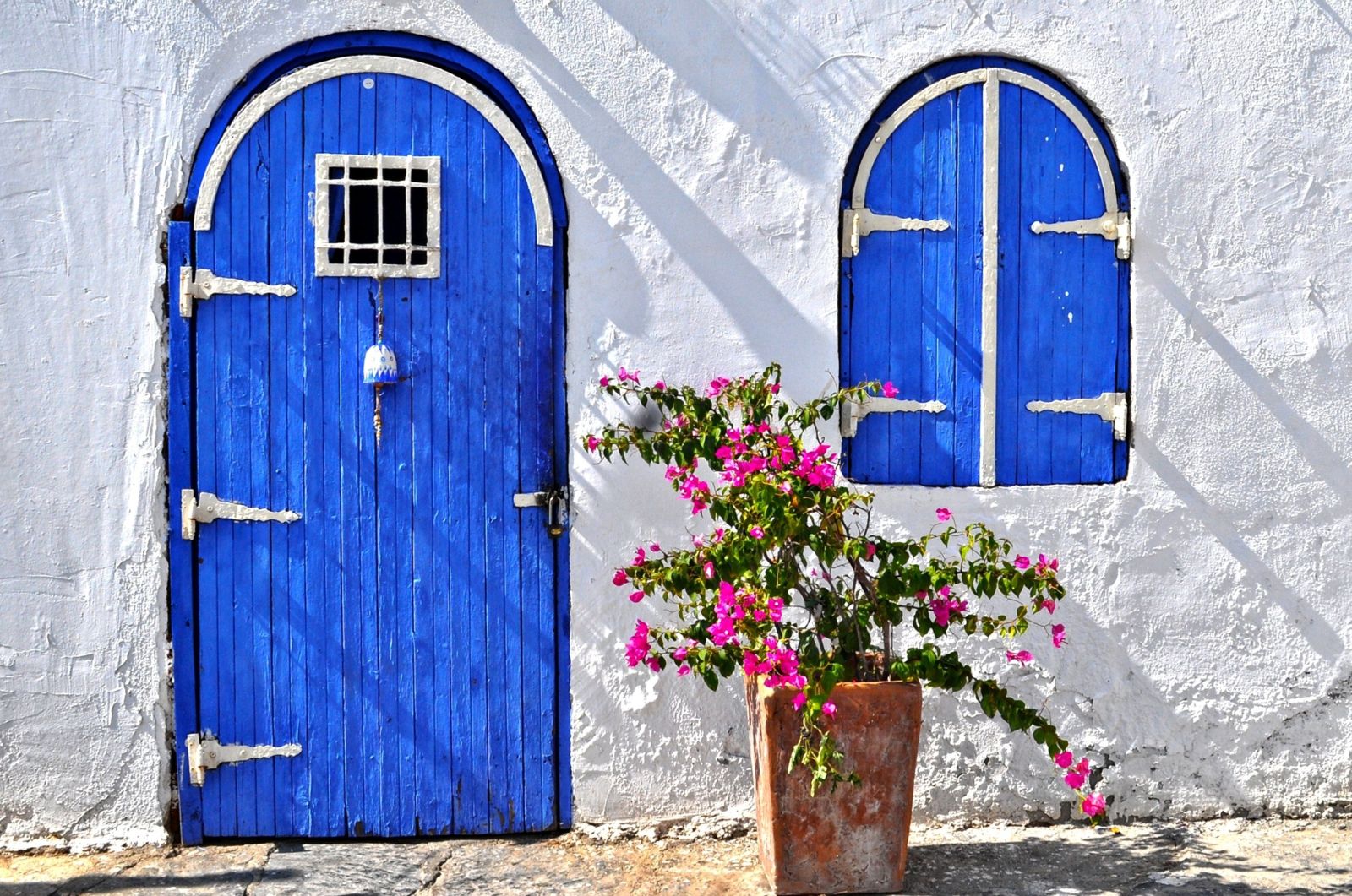 Colourful blue doorway of whitewashed house in Bodrum Turkey