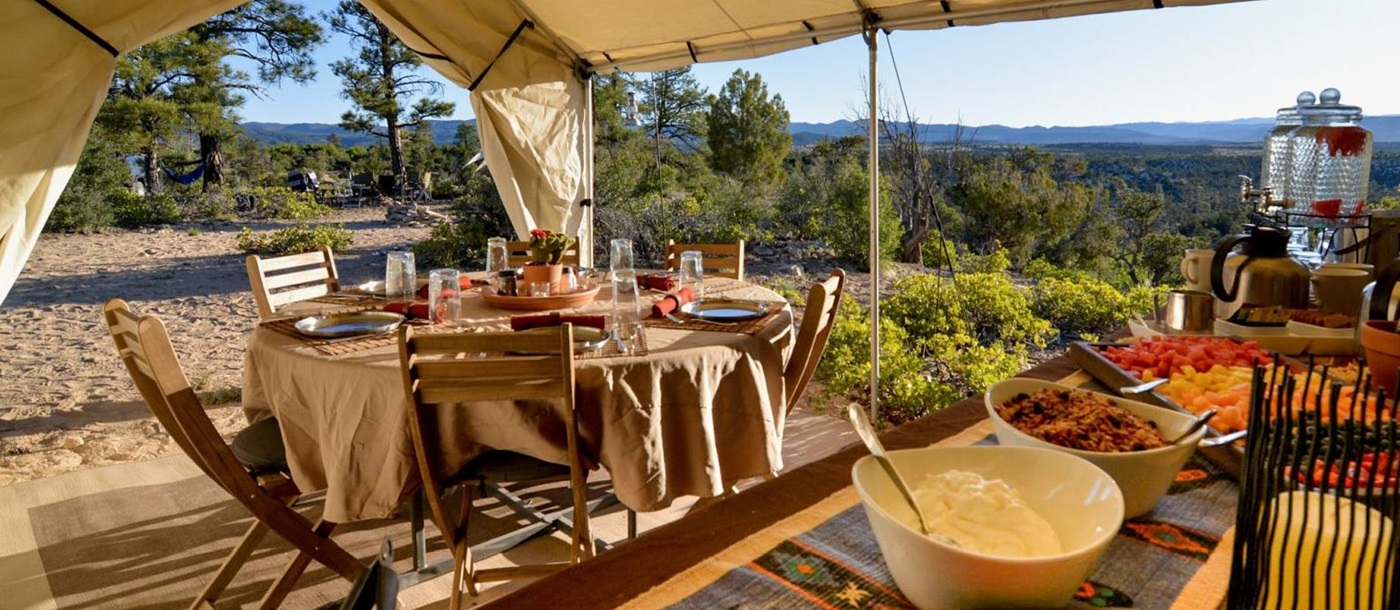 Buffet breakfast at a private campsite with panoramic views over Yellowstone National Park