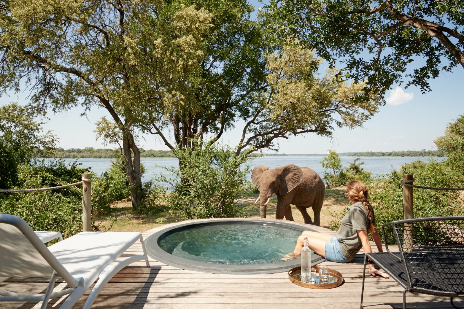 An elephant near a jacuzzi on the grounds of Victoria Falls River Lodge in Zambezi National Park in Zimbabwe