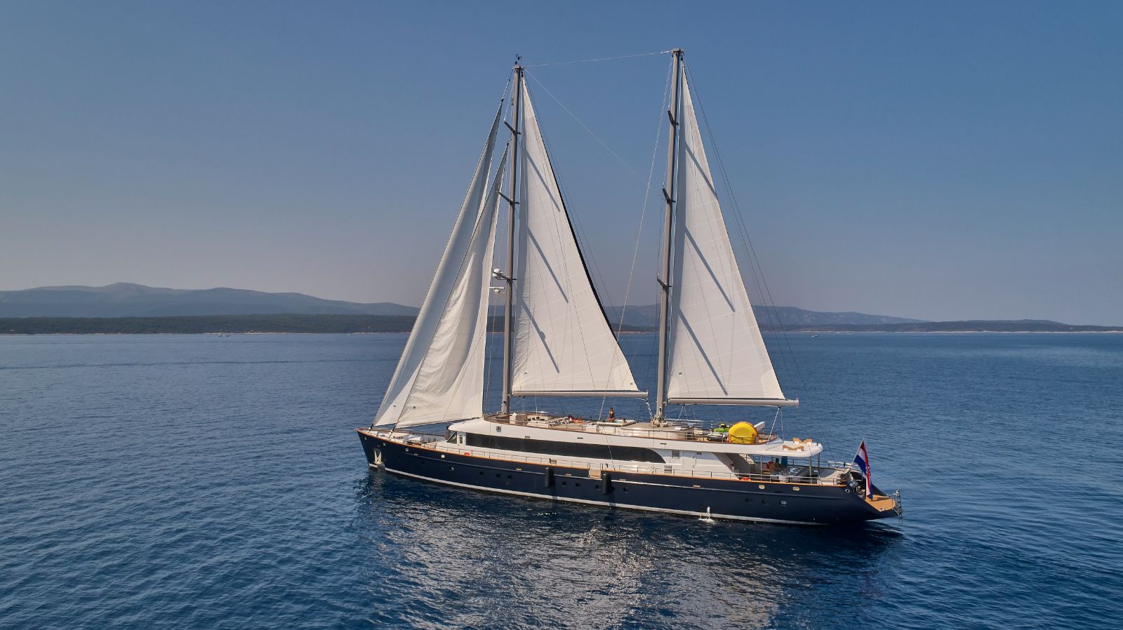 Exterior view of the Dalmatino gulet with sails up in Croatia
