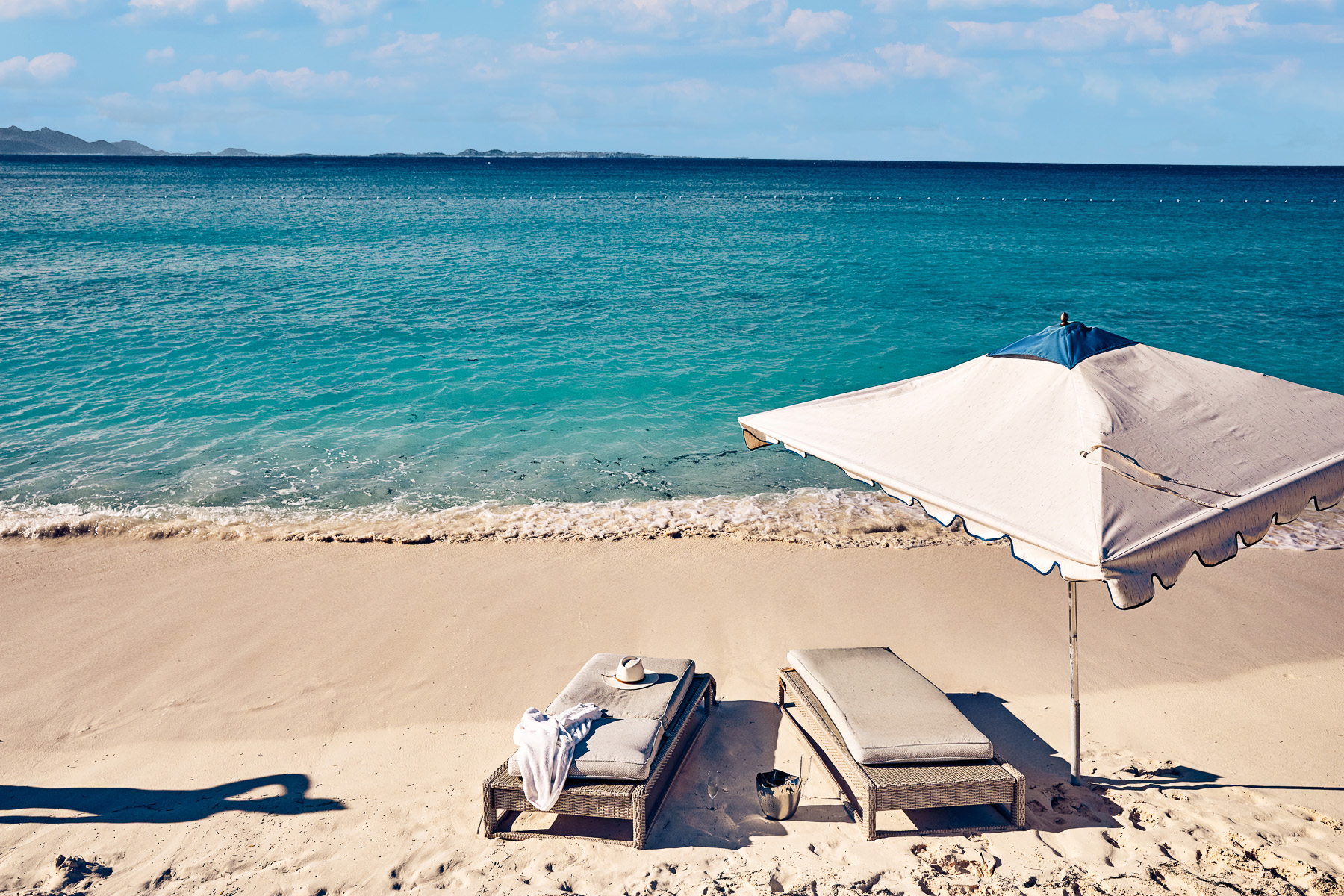 Beach loungers at Belmond's Cap Juluca resort in Anguilla