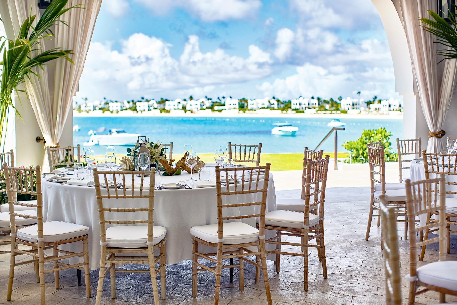 Dining table with sea views at Belmond's Cap Juluca resort in Anguilla