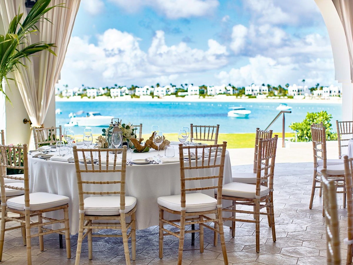 Dining table with sea views at Belmond's Cap Juluca resort in Anguilla