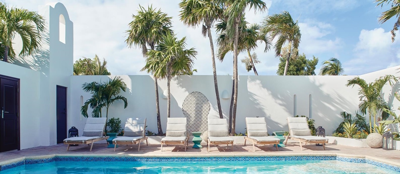 Loungers by the spa pool at Belmond Cap Juluca