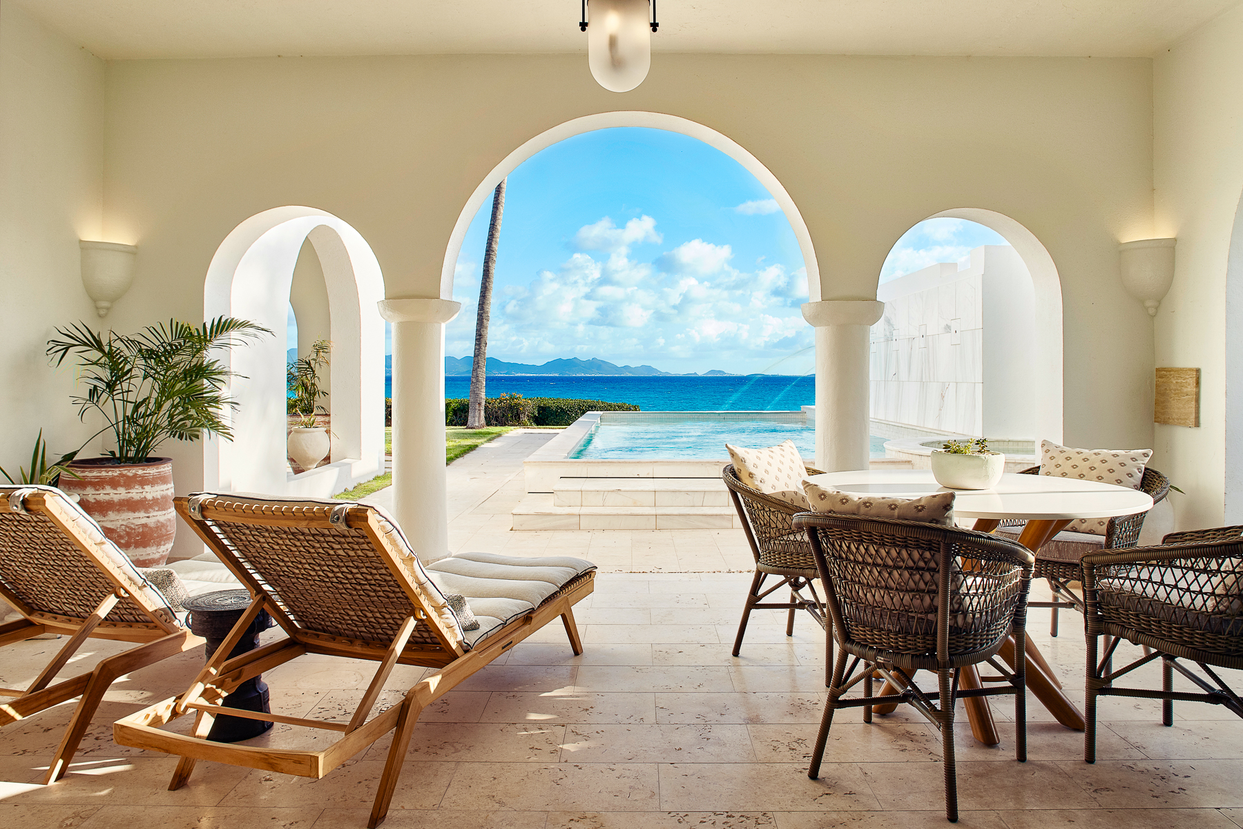 A terrace with ocean views at Belmond's Cap Juluca resort in Anguilla