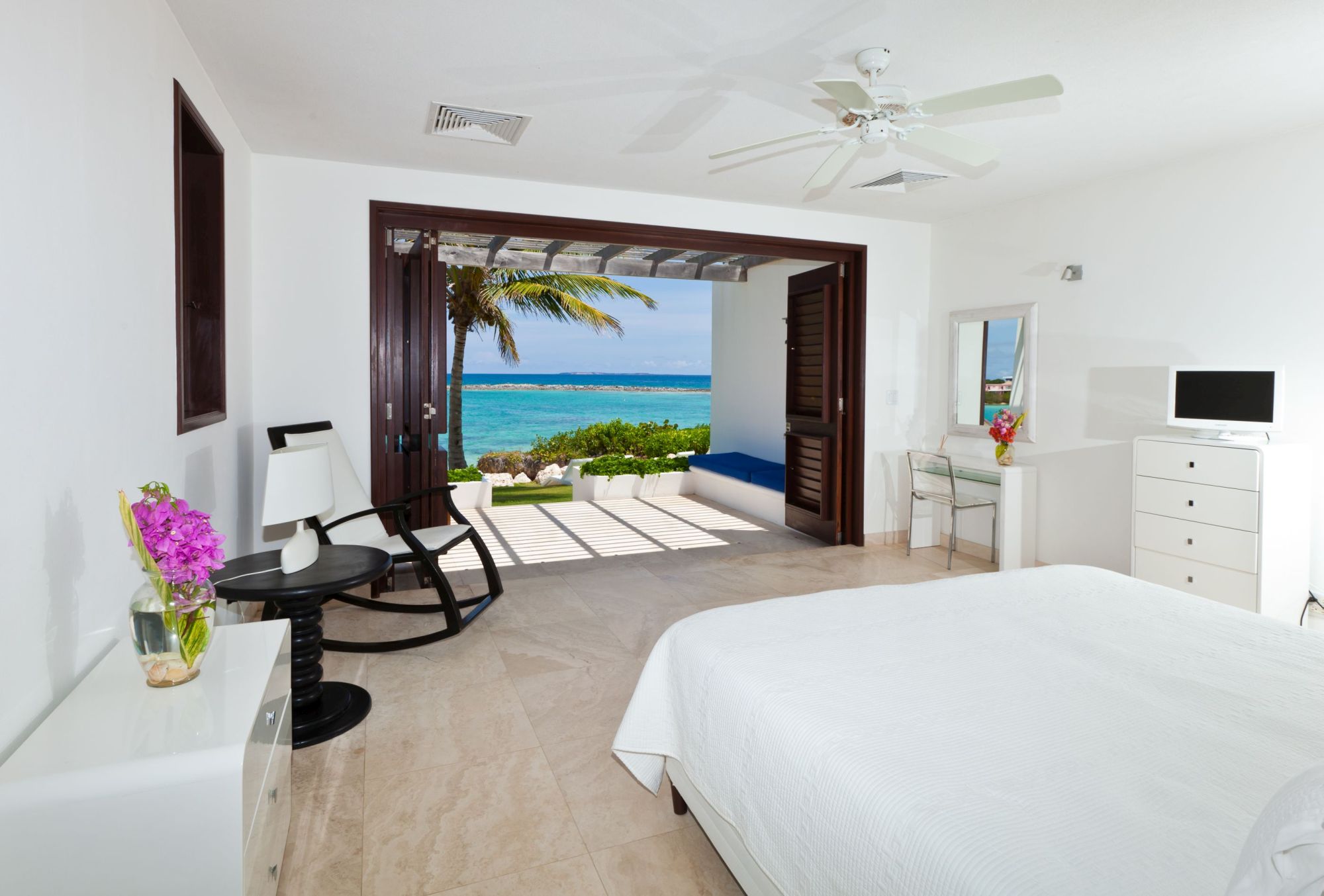 double bedroom with sea view of le bleu, anguilla