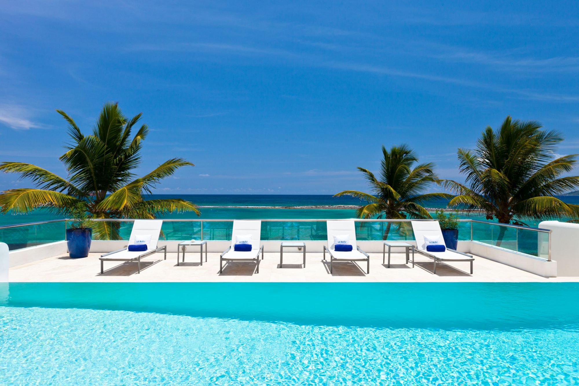 swimming pool and sun loungers of le bleu, luxury villa in anguilla